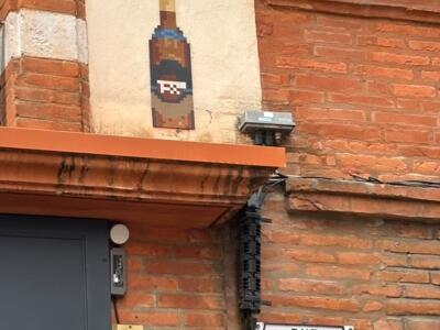 Rum Bottle on Rue Saint-Rome — Street art by Mifamosa in Toulouse