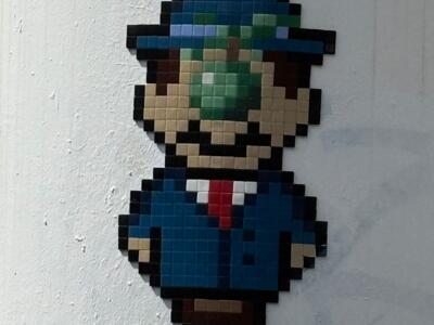 Mario as Magritte's Son of Man — Street art by IN THE WOUP in Paris