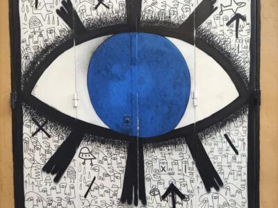 Blue Eye over a Wall of Doodles — Street art in València