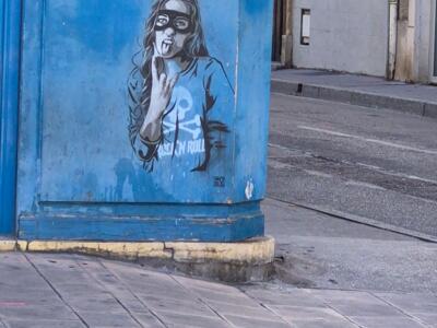 RNST's masked rock'n'roll girl — Street art by RNST in Dijon