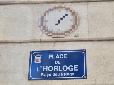The clock of Place de l'Horloge — Street art by Mifamosa in Avignon