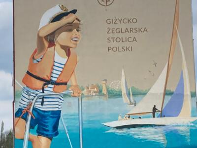 Giżycki tryptyk, the sailing capital — Street art by Maria Szulc in Giżycko