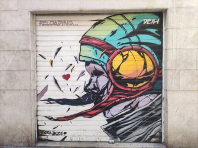 Reloading, Helmeted Figure with a Yellow Disc — Street art by Deih xlf in València