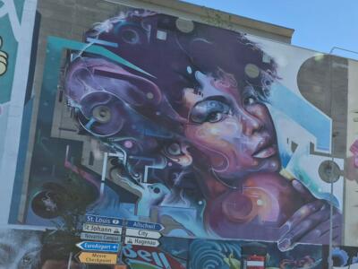 Female face with purple waves — Street art by Mr CENZ in Basel