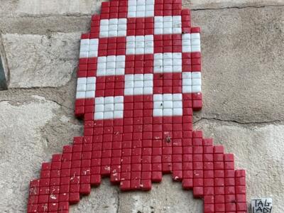 Tintin Rocket in Red Checkerboard — Street art by Tag Lady in La Rochelle