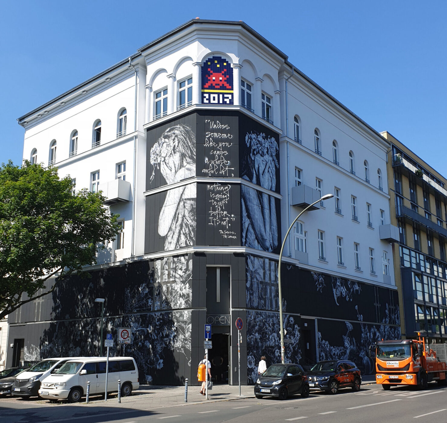 The façade in 2019, black and white from top to bottom, carrying a quote from Dr. Seuss's The Lorax. Photo: OTFW, Berlin, CC BY-SA 3.0, via Wikimedia Commons.