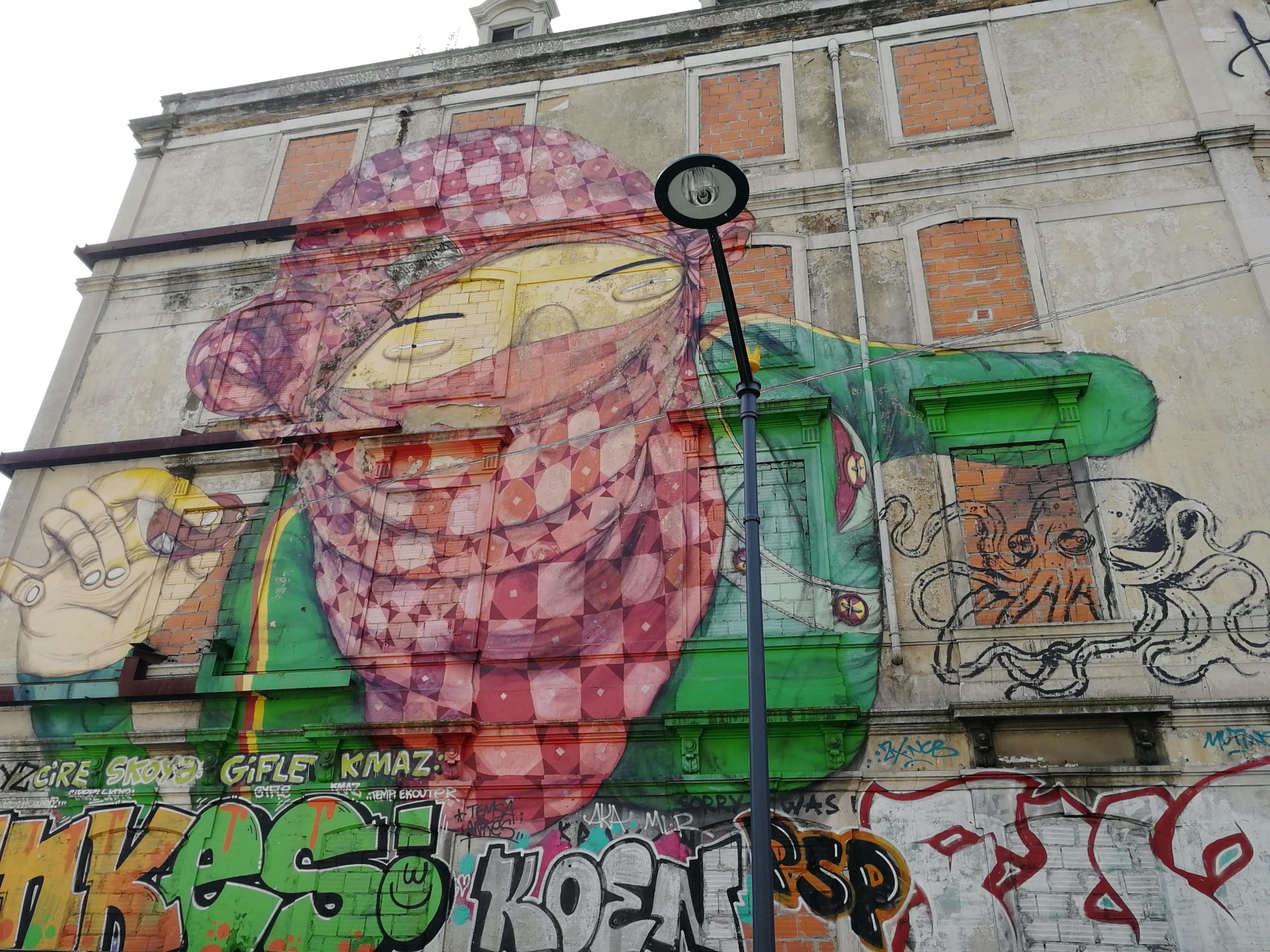 Graffiti 945  of Osgemeos in Lisboa Portugal