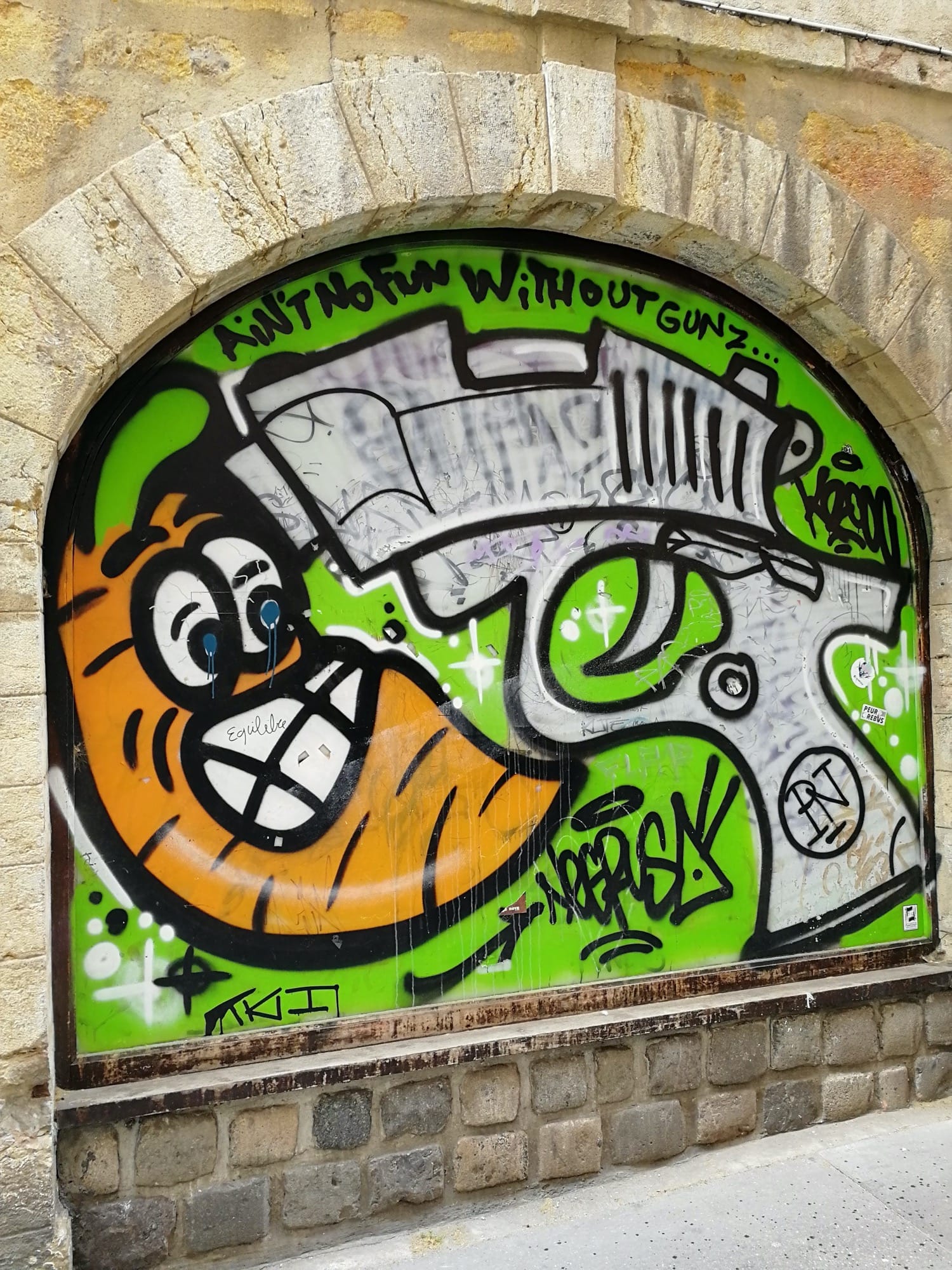 Graffiti 1549 Ain't no fun without gunz captured by Rabot in Lyon France