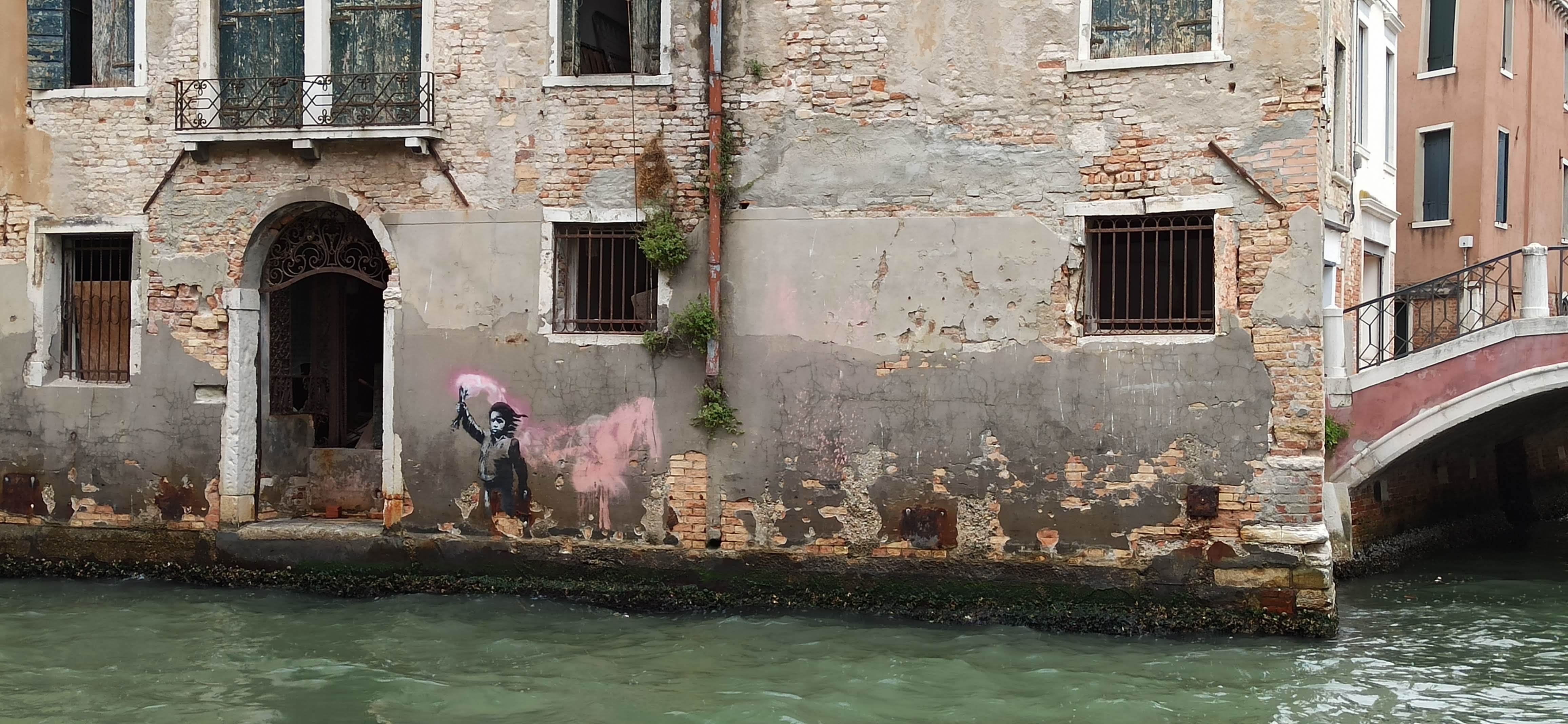 Graffiti 5338 Migrant child by the artist Banksy captured by Rabot in Venezia Italy