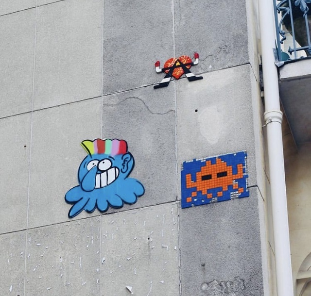 Sticking 5356 Trio by the artist Invader in Paris France